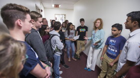 Florida Rep. Kristin Jacobs talks with student survivors from Marjory Stoneman Douglas High School in the hallway at the Florida Capitol in Tallahassee, Fla., Feb 21, 2018. (Mark Wallheiser/AP)