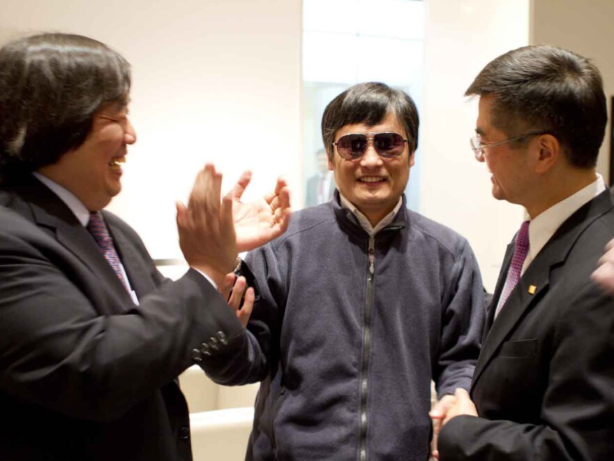 In this photo released by the U.S. Embassy Beijing Press Office, Chinese activist Chen Guangcheng (center) is seen with U.S. Ambassador to China Gary Locke (right) and U.S. State Department Legal Adviser Harold Koh before leaving the U.S. Embassy Wednesday for a hospital in Beijing.