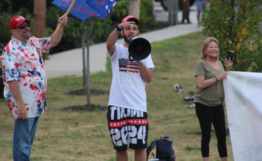 Counter protestors demonstrate to those who attended a vigil to honor the 26-year-old man believed to be Joan Sebastian Guerrero who was killed by federal immigration agents on the morning of July 13, 2026.