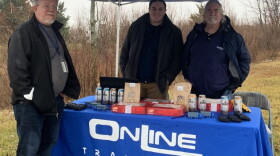 Celadon employee Mike Duckett visits with representatives offering help outside Celadon headquarters.