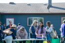Several community members gathered around a folding table in a backyard to leave comments and concerns.