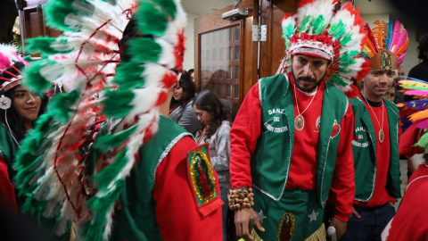 Matachines, traditional indigenous dancers, prepare to enter Sacred Heart Catholic Church in Merced during a celebration for Our Lady of Guadalupe.