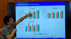 University of Connecticut researcher Luis Palomino presents his preliminary research on the economic contributions of Puerto Ricans living in U.S. states at the Connecticut State Capitol on the first day of UConn’s annual Puerto Ricans in CT summit, March 20, 2026. In Connecticut, Palomino estimates that Puerto Ricans in 2023 generated nearly 4% of the state GDP, which is more than major industries like construction and transportation.
