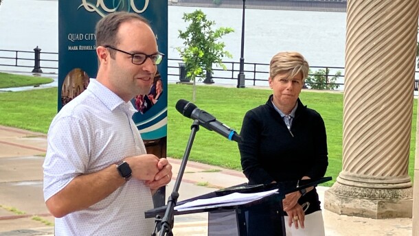 Brian Baxter, executive director of Quad City Symphony Orchestra, talks about the five-year sponsorship extension of Quad City Bank & Trust for the summer Riverfront Pops concert in LeClaire Park Aug. 5, as bank president/CEO Laura "Divot" Ekizian looks on.