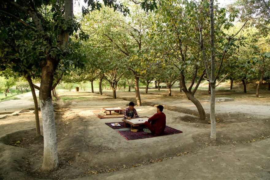The orchards and grassy lawns of Kabul's Babur Garden provide relief from the city's dusty chaos.