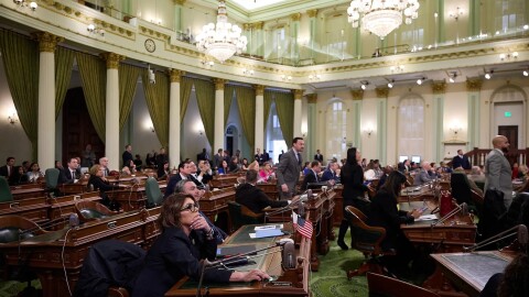 Assemblymembers watch the results of a vote during an Assembly floor session at the state Capitol in Sacramento on March 13, 2025.