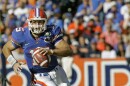 In this Nov. 17, 2007, file photo, Florida quarterback Tim Tebow scrambles during the second half of a football game against Florida Atlantic in Gainesville, Fla. Tebow was elected to the College Football Hall of Fame, Monday, Jan. 9, 2023.