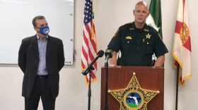 In this screen shot from a YouTube video posted by the Pinellas County Sheriff's Office, Pinellas County Sheriff Bob Gualtieri speaks during a news conference as Oldsmar, Fla., Mayor Eric Seidel, left, listens, Monday, Feb. 8, 2021, in Oldsmar, Fla. Authorities say a hacker gained access to Oldsmar's water treatment plant in an unsuccessful attempt to taint the water supply with a caustic chemical. (Pinellas County Sheriff's Office via AP)