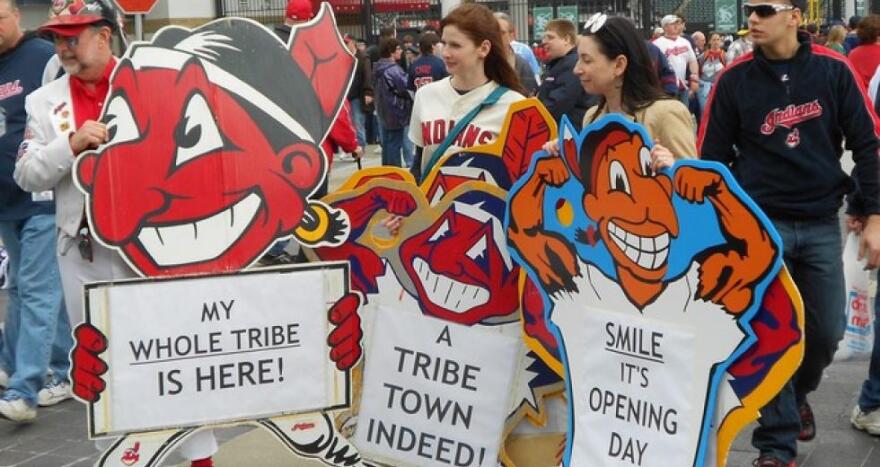 Cleveland Indians fans hold Chief Wahoo signs in 2013. [Brian Bull / ideastream]