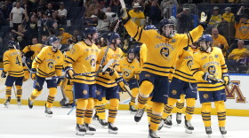 Quinnipiac players celebrate after the team defeated Michigan during an NCAA semifinal game in the Frozen Four college hockey tournament Thursday, April 6, 2023, in Tampa, Fla. (AP Photo/Chris O'Meara)