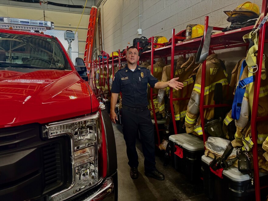 Assistant Fire Chief Travis Temarantz shows where firefighters keep their turnout gear so that it's separate from their civilian clothes.