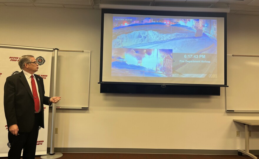 Indiana State Fire Marshal Steve Jones shows still images of the Jan. 21, 2023 fire that killed six children at 222 LaPorte Ave. in South Bend.