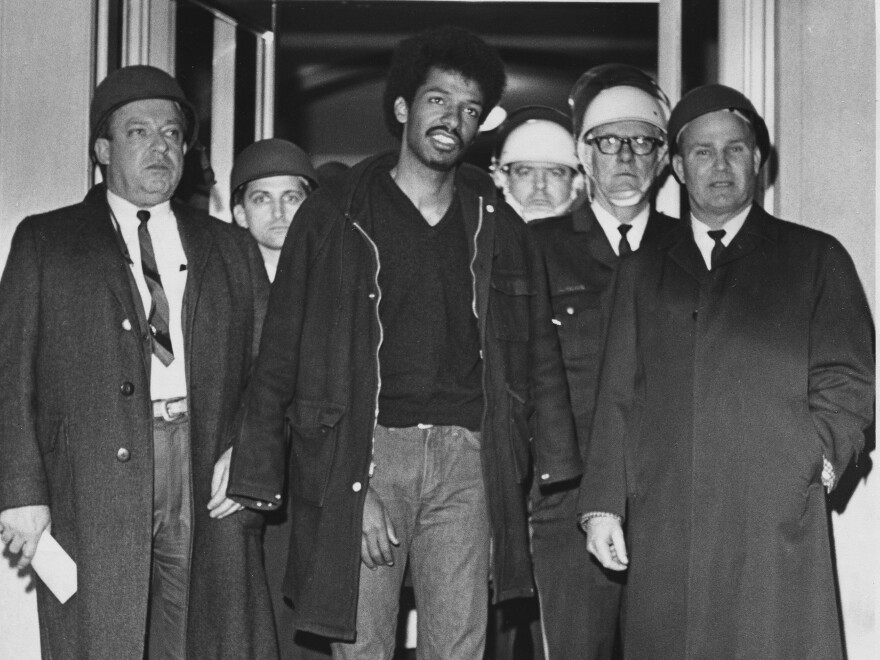 Cleveland Sellers, center, stands with officers after his arrest in Orangeburg, S.C., where three were killed and others wounded during a demonstration on Feb. 9, 1968.
