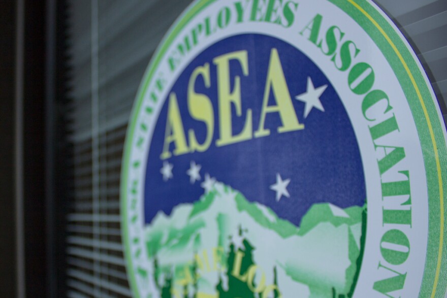 The Alaska State Employees Association sign on their office window. (Photo by David Purdy/KTOO)
