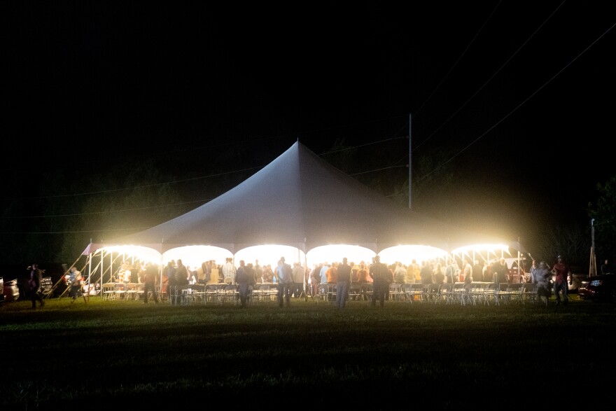 Hundreds gather at a tent revival on the outskirts of Oneida, Tenn. on Monday, Sept. 22, 2025. The revival was organized by local pastors in the area who feel that their community’s faith has faltered in recent years. They decided to get back to their roots with a ‘no-frills’, traditional southern gospel tent revival in late September.