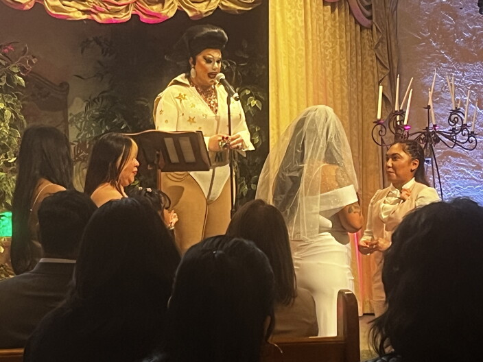 A "Shelvis" — Elvis impersonator dressed in drag — officiates a wedding at the Little While Chapel on New Year's Eve 2023 in Las Vegas. New Year's Eve 2023 was a date with a repeating pattern — 12/31/23 — and a popular wedding date. There are other "palindromic" dates coming up in April, such as 4/20/24 and 4/22/24 that could prove to be popular as well.