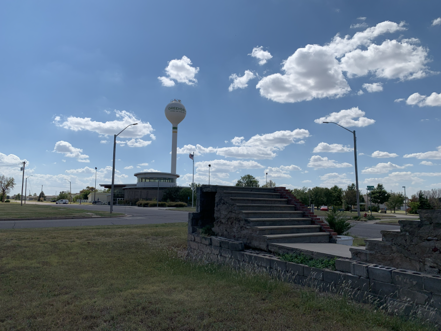 In the foreground is the remains of a building destroyed in the 2007 EF-5 tornado; background is Greensburg's Big Well Museum.