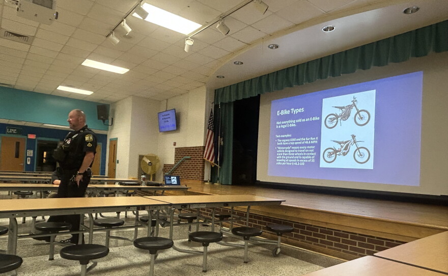 Virginia Beach Police MPO Tony Espinosa talks with families about e-bike safety at Cooke Elementary on Sept. 26, 2026.