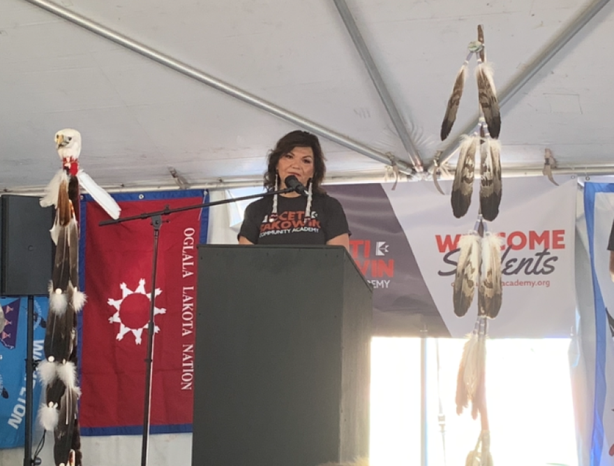 Mary Bowman addresses parents, students, and leaders as the Oceti Sakowin Community Academy opens to its first class of students.