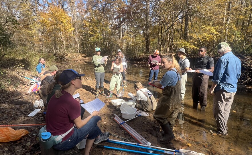 On November 8, 2025, a group of volunteers receives training while at New Hope Creek in Durham to join the Haw River Watch Program.