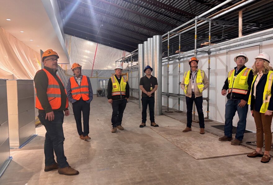 U.S. Rep. Eric Sorensen (D-Moline), left, speaks with union workers who are part of the current construction at Quad Cities International Airport, Friday, Oct. 16, 2026.