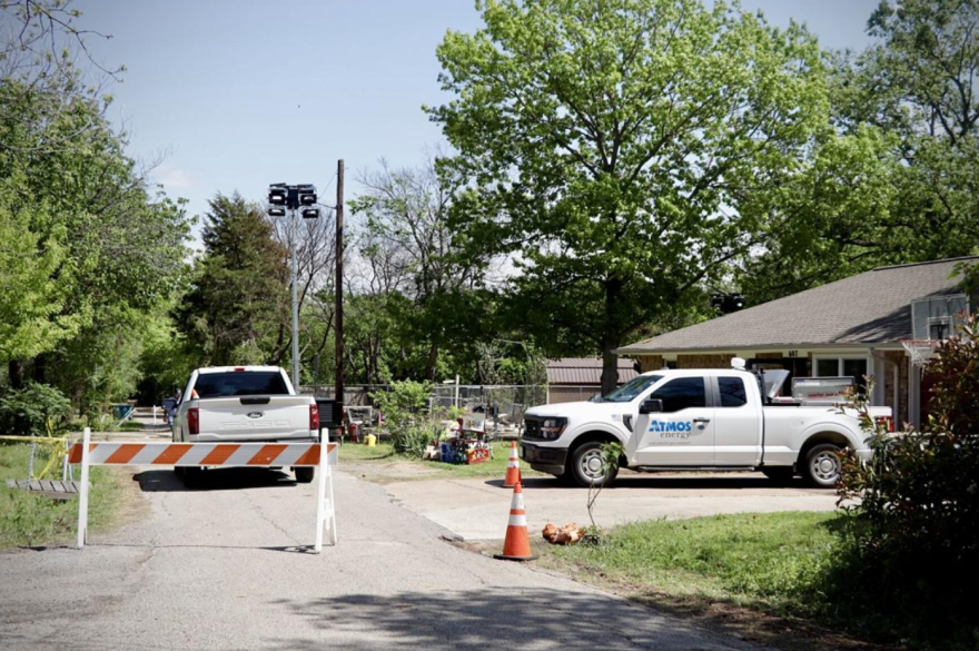Atmos Energy crew vehicles park in a restricted area of the 600 block of Moseley Street in Lake Dallas. On the other side of these vehicles is the property where a house exploded March 19 due to a gas leak, hospitalizing a woman.