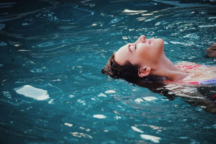 A woman swims in a pool