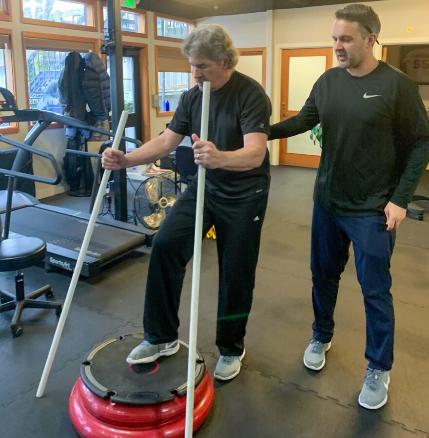 Randy Devitt working out with Nate Coomer. (Cloe Axelson/WBUR)