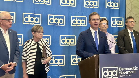 Kentucky Gov. Andy Beshear chairs the Democratic Governors Association. He stands alongside Democratic Governors Tim Walz of Minnesota, Laura Kelly of Kansas, Bob Ferguson of Washington and Matt Meyer of Delaware.