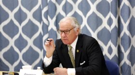 South Carolina Gov. Henry McMaster looks at data about the COVID-19 spread in the Kershaw County School District during a discussion with school officials at Camden Elementary School on Wednesday Sept. 15, 2021, in Camden, S.C. Nurses, principals and school board members were part of the roundtable discussion. (AP Photo/Jeffrey Collins).