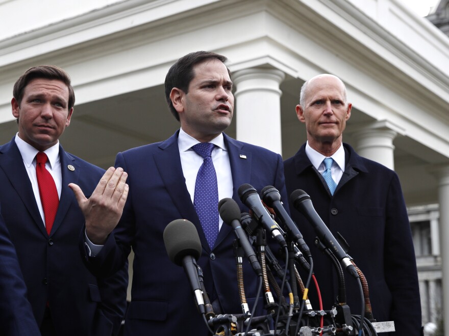 In this Jan. 22, 2019, photo, Rep. Mario Diaz-Balart, R-Fla. (not pictured), Florida Gov. Ron DeSantis, Sen. Marco Rubio, R-Fla., and Sen. Rick Scott, R-Fla., speak to the media after their meeting with then-President Donald Trump about Venezuela, at the White House in Washington, D.C.