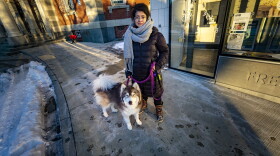 Tatiana Saenz with her dog outside of the Jamaica Plain branch of the Boston Public Library. (Jesse Coista/WBUR)