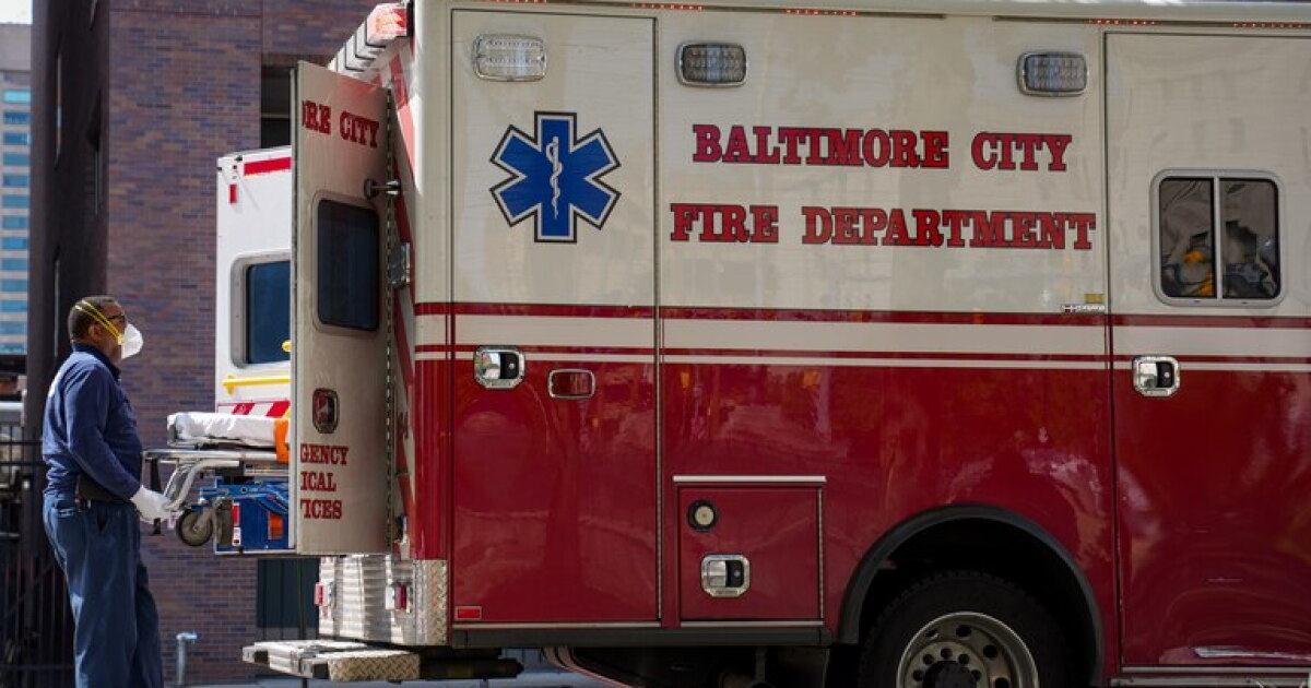 Photo: wypr.org A member of the Baltimore City Fire Department’s Emergency Medical Services team loads up a stretcher into the back of an
