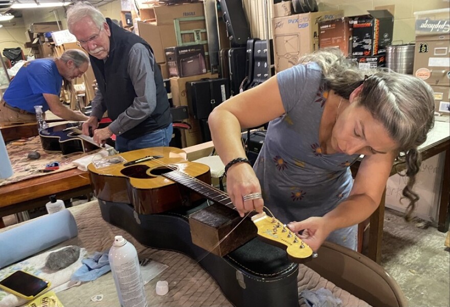 Volunteers working on instruments to send to eastern Ky.