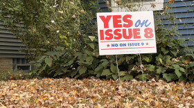 A yard sign in Merion Village tells Columbus voters to vote "yes" on Issue 8 and "no" on Issue 9 in the 2026 election.