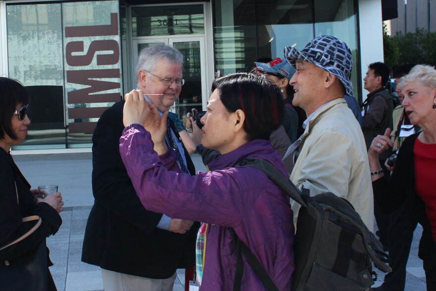 John Nagel greets photography members of the Nanjing Federation for the Arts