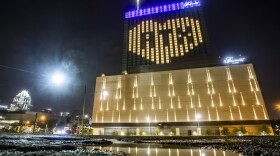 The Fairmont Hotel is lit up with ATX inside a heart.