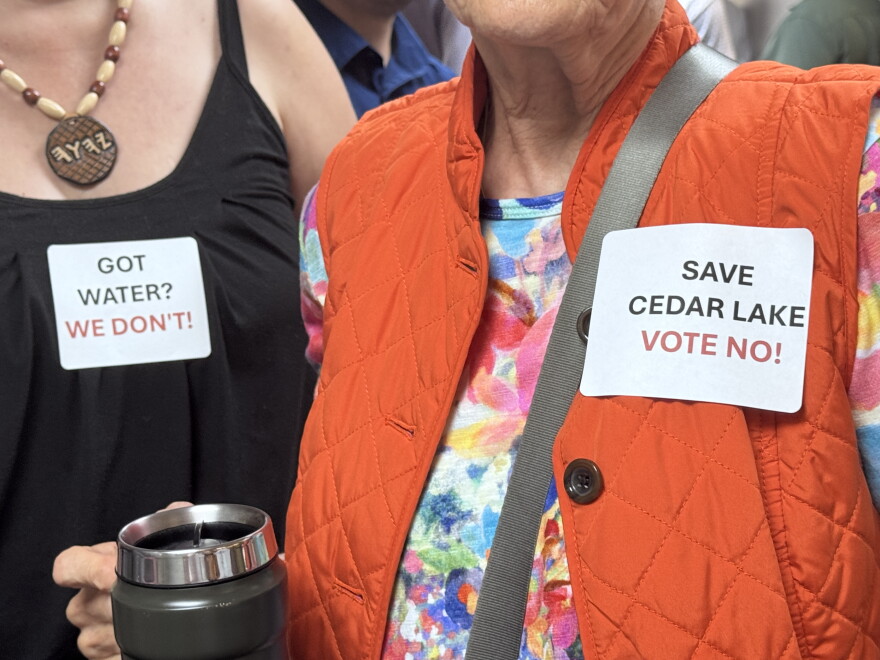 Cedar Lake residents sported stickers at an Oklahoma Water Resources Board meeting in July.
