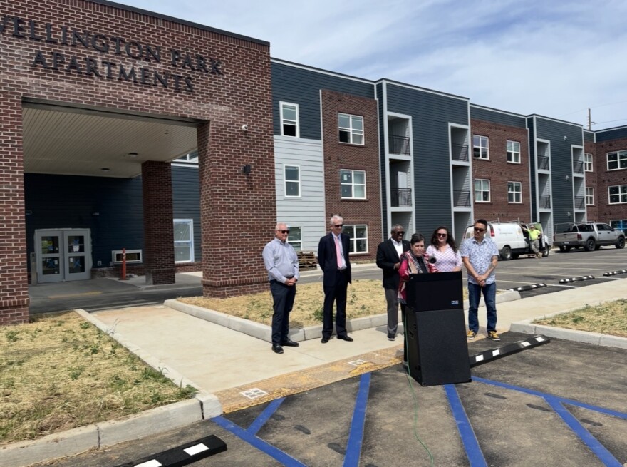 Lexington officials, including Mayor Linda Gorton, made remarks in front of Wellington Park Apartments Friday. The city is touting the development as the city's first fully ADA-accessible affordable housing project.
