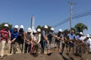 State and city officials break ground on the Cairo, Illinois, 3D-printed duplex project in August 2024.