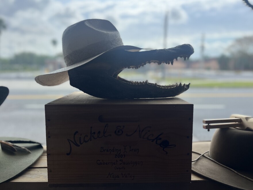 Dudney said he uses an alligator head, gifted from his uncle, to display some of his hats.