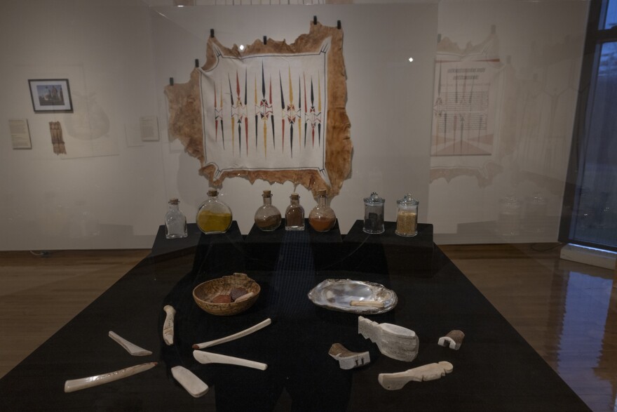 objects on a table appearing to be 330-year-old Indigenous painting items like pigments.