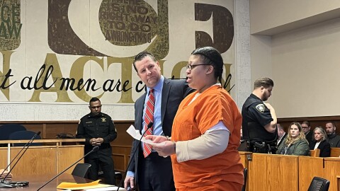 Persia Nelson reads her statements in court.