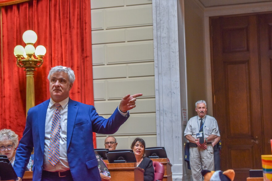Rep. Jason Knight, a Barrington Democrat, defends his bill to ban assault-style weapons during debate on the House floor on June 5, 2025.