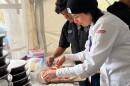 Chef Janet Zapata prepares a pizza at the Pizza Fest Challenge in Montreal.