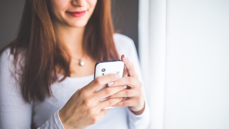 A woman browsing her smartphone