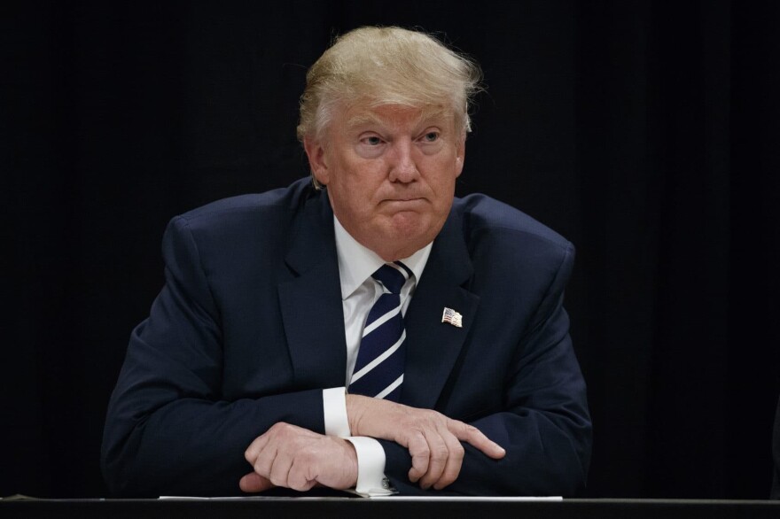 Then-Republican presidential candidate Donald Trump meets with community leaders and addiction specialists in October 2016, in Manchester, N.H. (Evan Vucci/AP)
