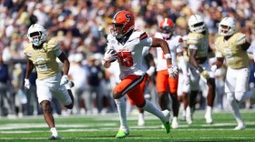 Syracuse wide receiver Darrell Gill Jr. (15, White) hustles past the Georgia Tech defense for a touchdown