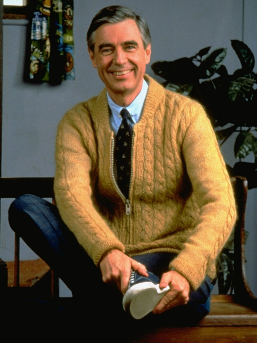 Fred Rogers poses on the Pittsburgh set of his television show <em>Mister Rogers' Neighborhood</em> in 1996.