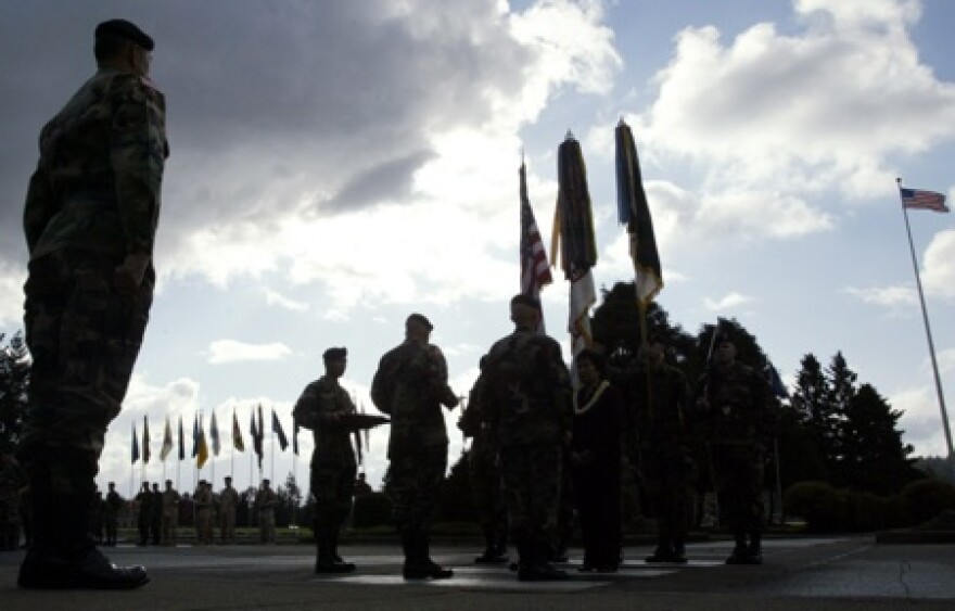 A change of command ceremony at Joint Base Lewis-McChord near Tacoma. The News Tribune reports thousands of soldiers were deployed overseas at the time of the recent U.S. Census, affecting true population counts in many Pierce County communities.